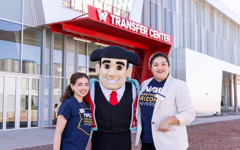 Arizona Western College mascot Mateo the Matador stands outside the new AWC Transfer Center with Transfer Services representatives from Northern Arizona University-Yuma.