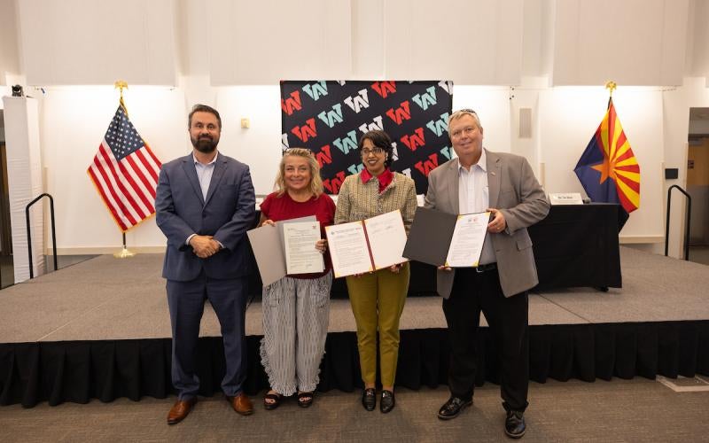Presenting the MOUs. Left to right: Dr. Shadi Kilani, Executive Vice President of Arizona Western Entrepreneurial College, Renee Macaluso, Dean of Mathematics, Science & Engineering, Dr. Reetika Dhawan, President, and Bryan Doak, Executive Vice President for Learning & Student Services.