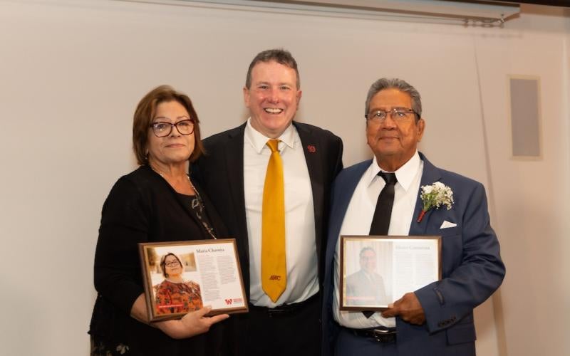 Caption information: AWC President Dr. Daniel Corr stands between the 2025 AWC Hall of Fame inductees, Maria Chavoya (left) and Moses Camarena (right) at the annual Schoolhouse Soirée in October 2025.