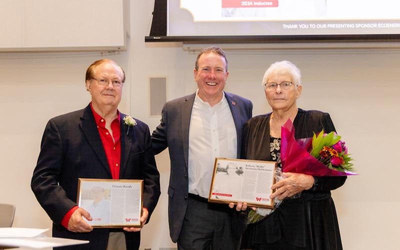 AWC President Dr. Daniel Corr stands between 2024 Hall of Fame inductees Dennis Booth and Bobbi McDermott at the 2024 Schoolhouse Soirée.
