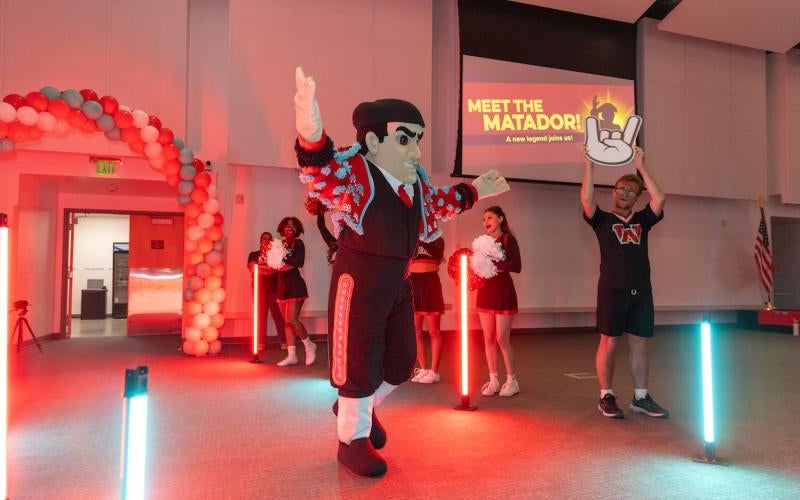 Mateo the Matador is greeted by the cheer team at the Meet the Matador event