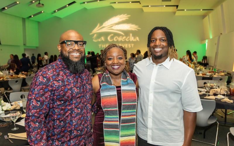 An honored student at La Cosecha celebrates with her family.