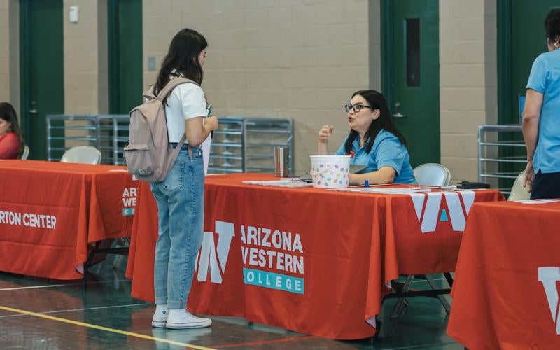 AWC Enrollment Tour brings resources to high school seniors in a local high school gymnasium.