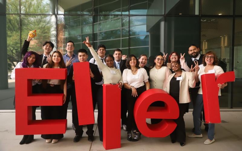 Arizona Western Business Club students pose with the red Eller College letters.