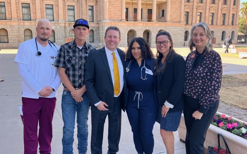 AWC students and staff stand outside the Arizona State Capitol building in Phoenix, Ariz. Left to right: AWC students Alexander Young and Dustin Robert Wood, President Dr. Daniel Corr, Director of Nursing Stephanie Francis, Chief of Staff Ashley Herrington, and Vice President for Advancement Lori Stofft.