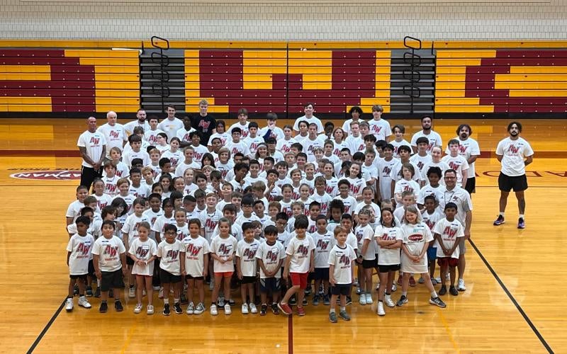 Students learn basketball fundamentals at the 2024 Chapman Automotive Summer Basketball Camp.
