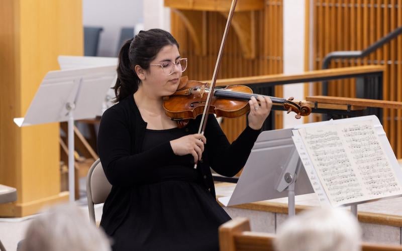 Violinist performs at the Faculty Chamber Music Concert in April 2024.