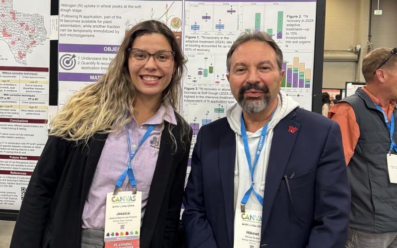 A PhD student (left) presents her research to Dr. Budak (right) at the ASA conference (CANVAS) in November 2025.