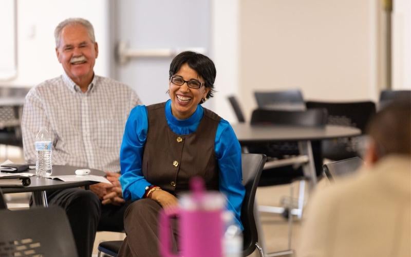 Dr. Reetika Dhawan laughs as she meets with residents in Quartzsite, AZ.