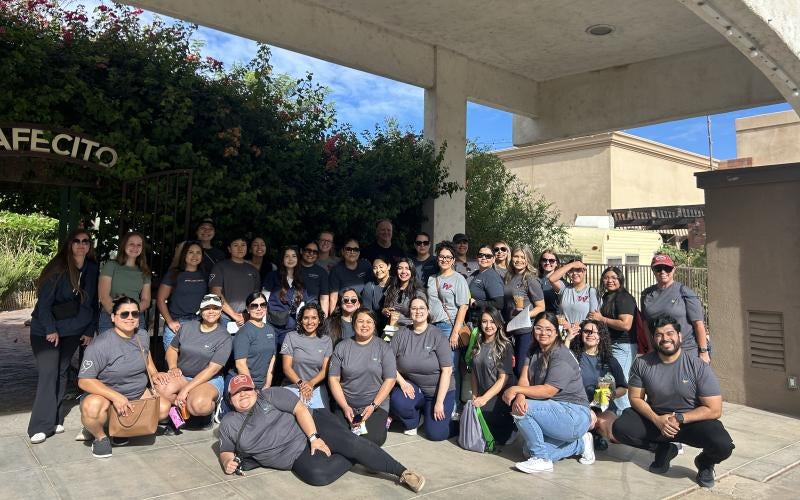 Honor society students gather outside Cafecito in Downtown Yuma after spending the day distributing homeless care packages.
