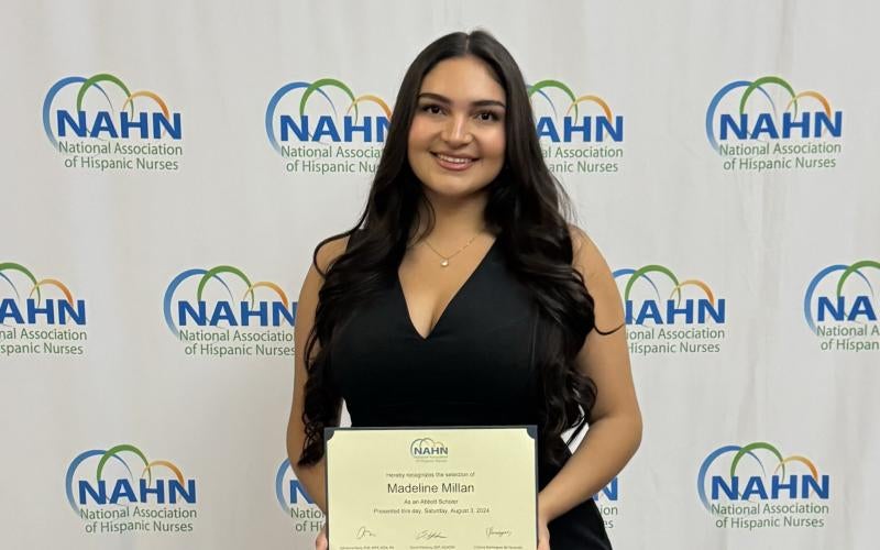 Madeline Millan holds her award at the 49th Annual NAHN Gala in Atlanta, GA