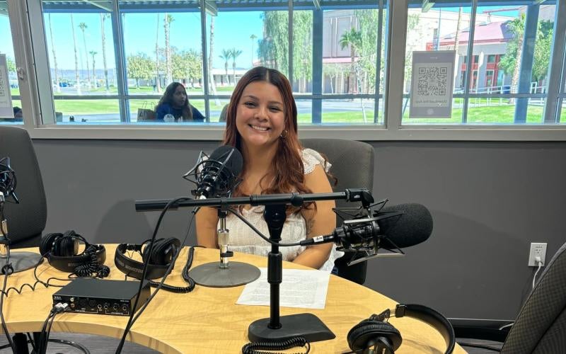 AWC student Mily Canela records audio files for the Yuma History app in the KAWC radio studio.