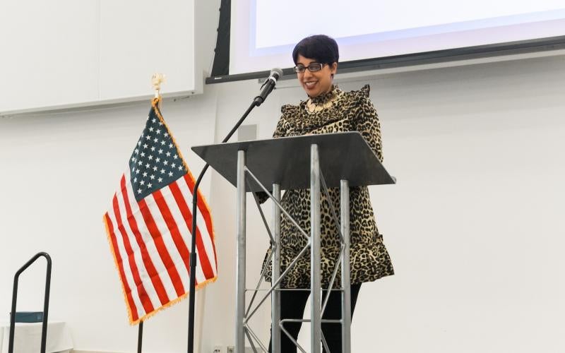 Dr. Reetika Dhawan speaks at a podium