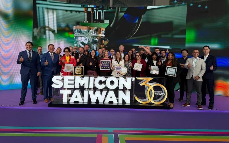 Dr. Reetika Dhawan (in red) stands between Supervisor Lines (left) and Mayor Nicholls (right) among other members of the Arizona delegation at SEMICON Taiwan 2025.