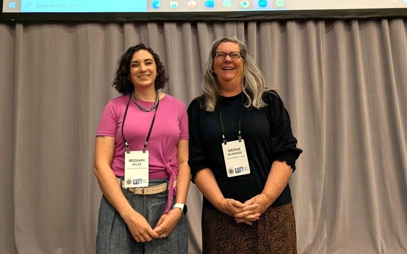Weena McKenzie (right) stands with co-presenter Meghan Velez at the 22nd Biennial Conference of the Rhetoric Society of America in Portland, Oregon in May 2026.