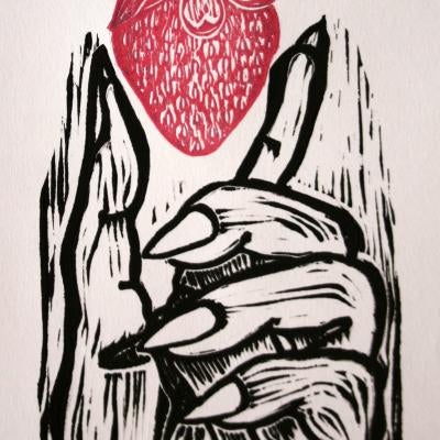 printmaking piece of a hand holding a strawberry