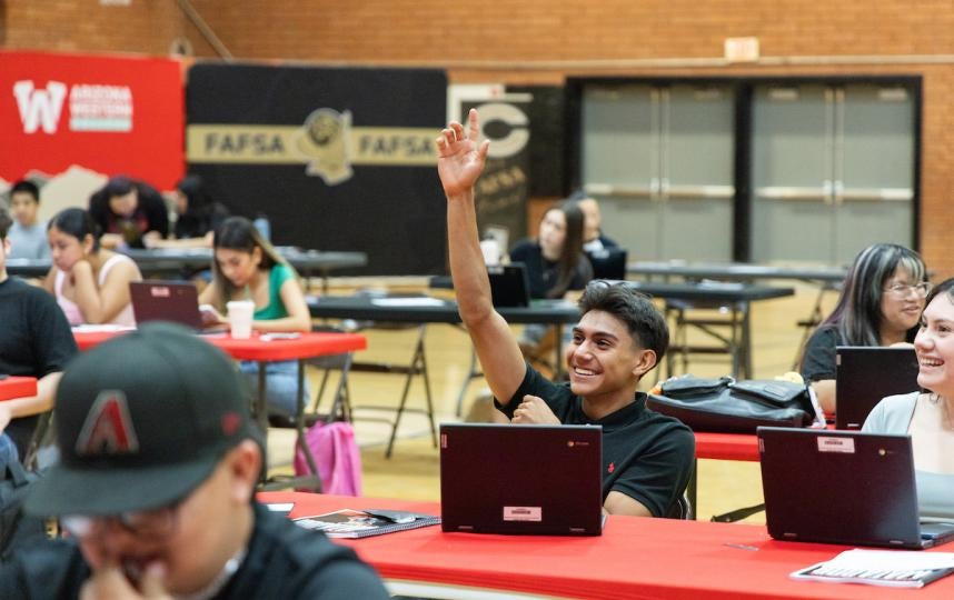 High school student raising his hand