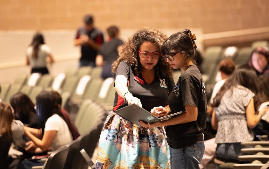 AWC staff member helping a student