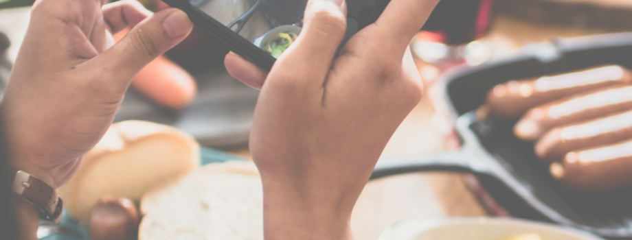 Cell phone taking picture of food