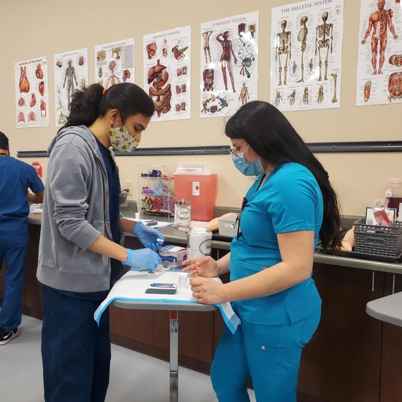 Medical Assistant Student testing glucose