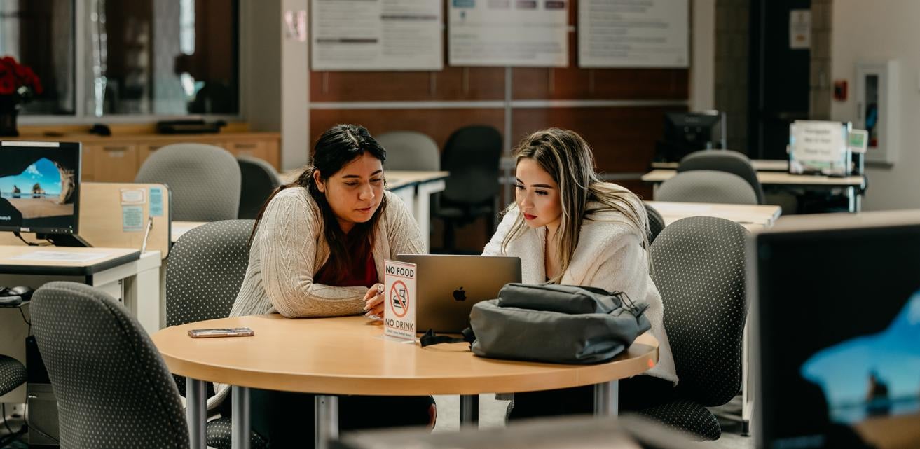Tutoring with a student in the Student Success Center