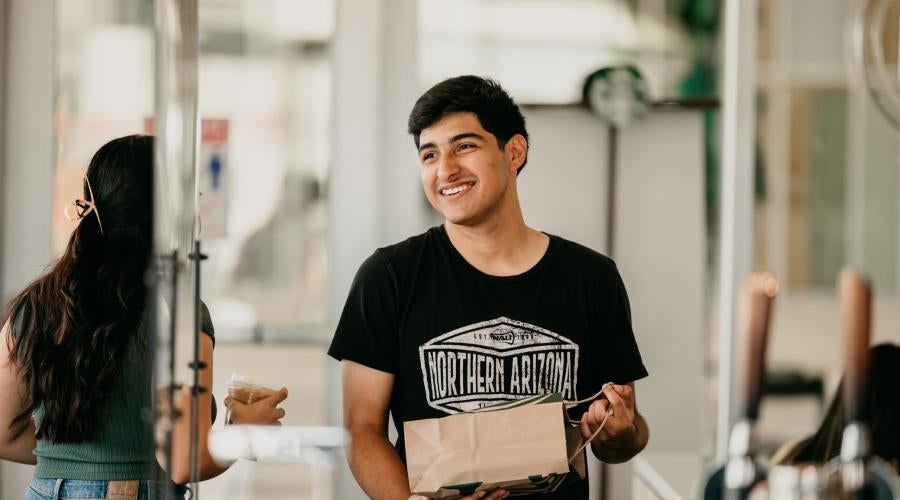 Student wearing a NAU shirt